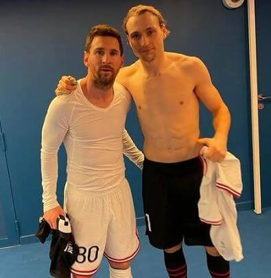 Lovro Majer with Leo Messi.